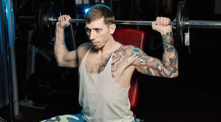 The Great Debate: Is the Behind-the-Neck Press a "Forbidden" Lift or an Elite Builder?